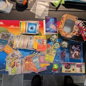 100+ Assorted Pokemon Cards (including 30+ holos) with accessories